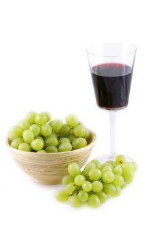 Wine and grapes isolated on white.