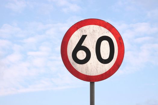 European dirty 60km speed limit traffic sign (blue sky background)
