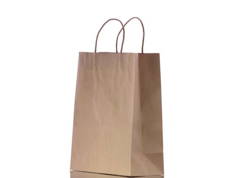 Brown eco paper bag isolated on white background