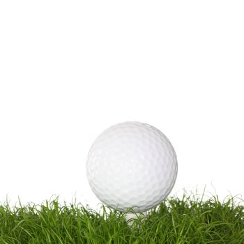 A golf ball in the grass isolated on white background