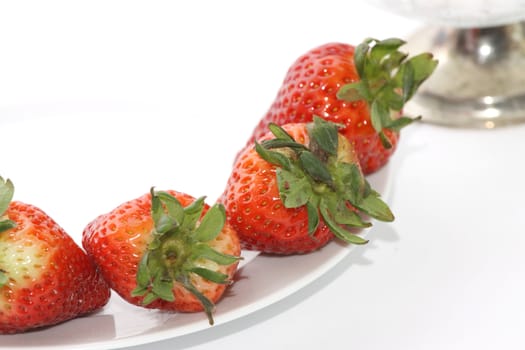 Fresh and tasty strawberries over white background