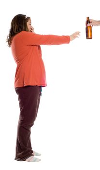 A young girl holding her nose and waving away an offering of a bottle of beer, isolated against a white background