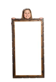 Full body view of a young girl standing behind a large display, isolated against a white background