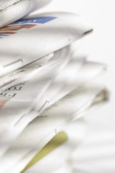 pile of newspapers on the table