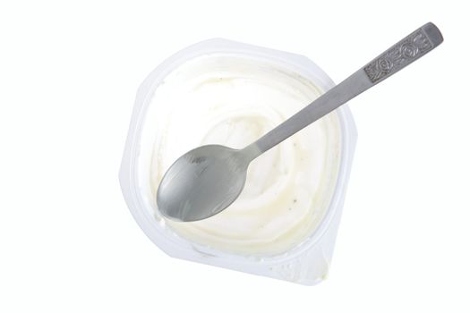 Empty yogurt with spoon isolated on white background