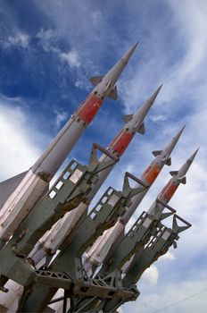 Several combat missiles aimed at the blue sky. Missile weapons.