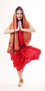 girl in red dancing in indian style