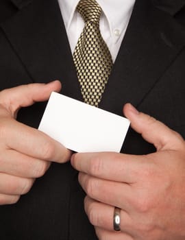 Businessman with Coat and Tie Holding Blank Business Card.