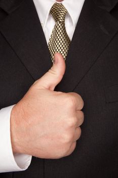 Businessman with Coat and Tie Gesturing Thumbs Up with Hand.