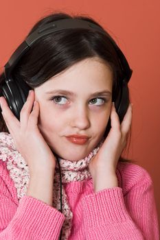 pretty girl listening music in headphones