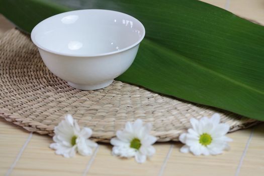 Tropical Spa background (green leaf, white flowers, oil)