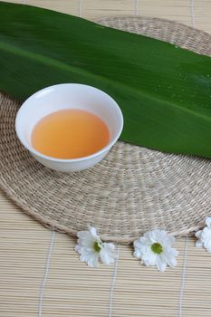 Tropical Spa background (green leaf, white flowers, oil)