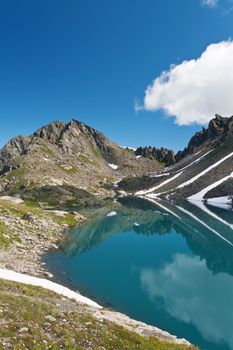 summer view of Pietra Rossa (Red Stone) lake in Aosta valley, Italy