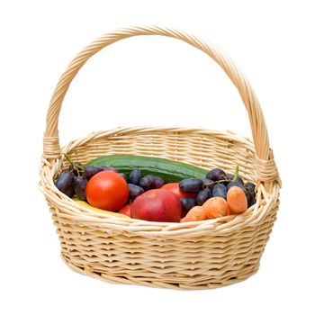 Vegetables and fruits in a basket. Isolated on white.