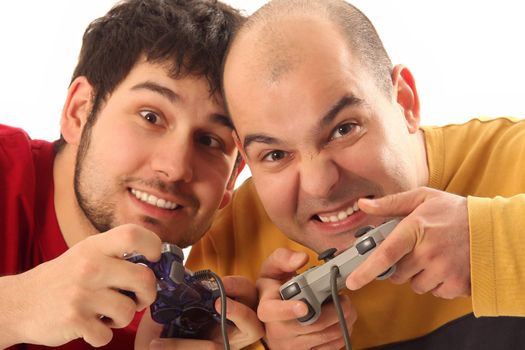 Two young men playing video game console controller