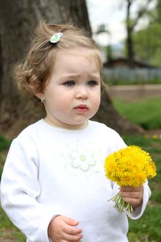 beautiful pretty girl with flower in the park