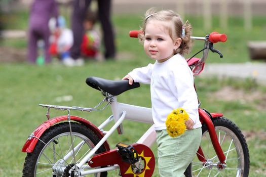 beautiful pretty girl with flower and bicycle