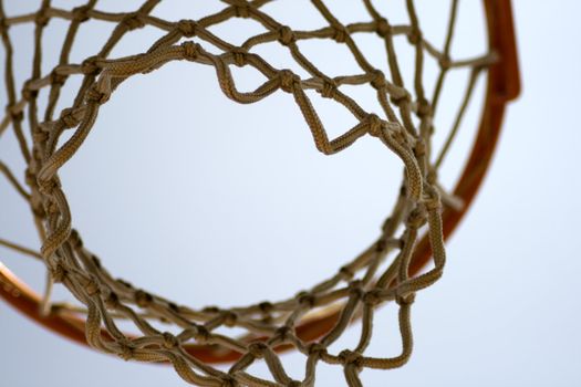 A basket for basketball seen from under