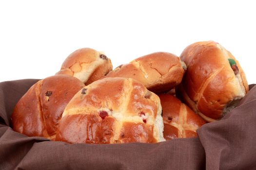 hot cross buns in a basket, white background