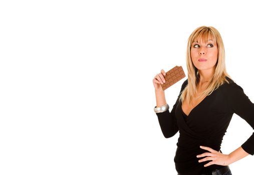 young girl eating chocolate on white background