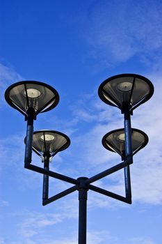 Photo of street lamps on blue sky