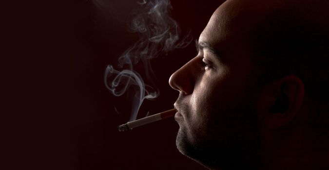 close up of an smoking man