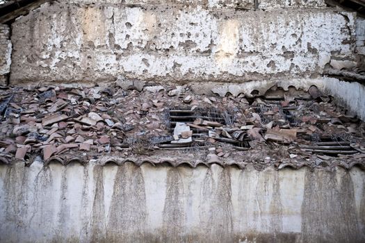 Tile roof crumbling, old house in Spain