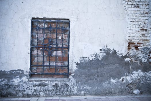 old street with boarded window