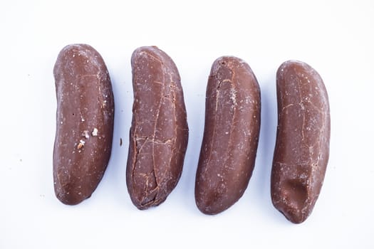 Delicious chocolate pralines over white background.