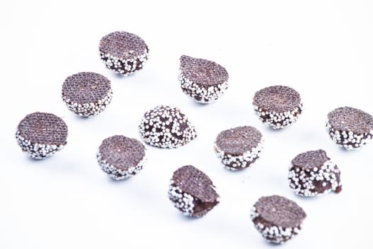 Delicious chocolate pralines over white background.