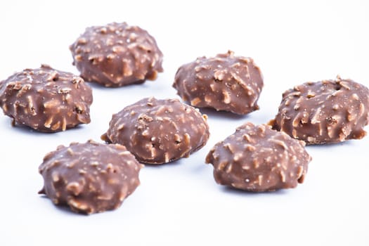 Chocolate candy over white background.