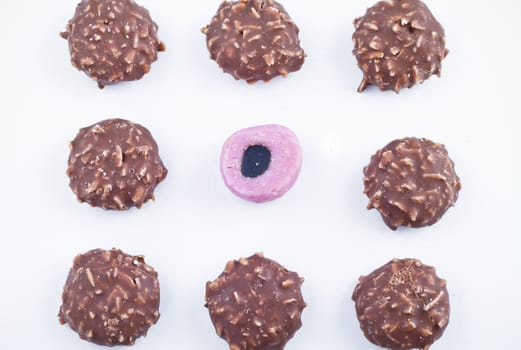 Delicious chocolate pralines over white background.