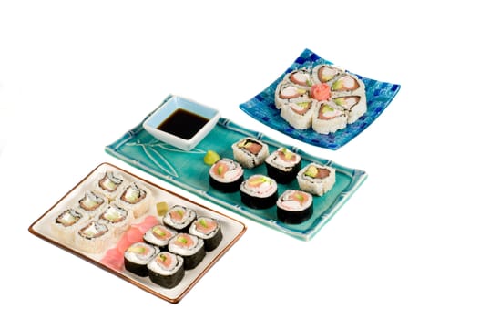 A selection of rolls sushi against a white background