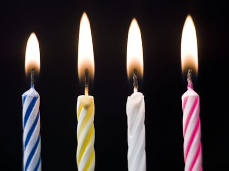 Burning Birthday Candles on black background