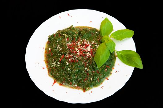Spinach with fresh leaves of basil