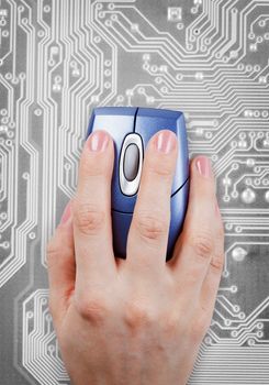 Hand and computer mouse on an gray electronic background