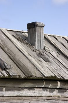Photo of a rural structure with a pipe
