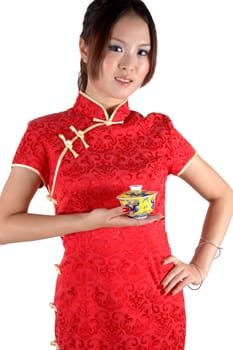 Asian model holding small tea cup. Chinese girl, cute and young model with happy face expression.