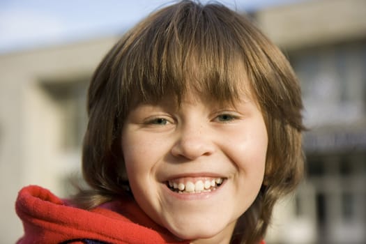 Photographic portrait a fullface of the laughing girl