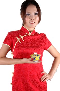 Asian model holding small tea cup. Chinese girl, cute and young model with happy face expression.