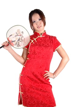 Chinese model in traditional dress called QiPao, holding fan. Asian cute girl, young model with friendly and happy face expression.