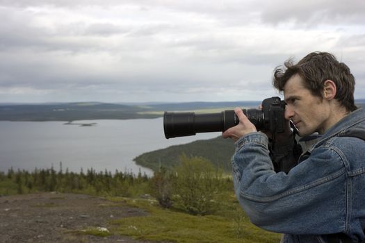 The image of the photographer against the nature