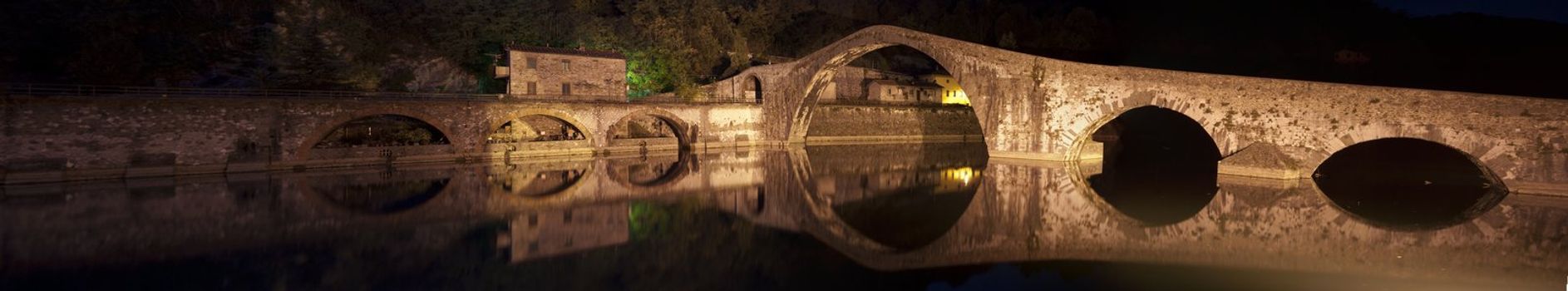 Colors and Reflections of Devils Bridge at Night, Italy