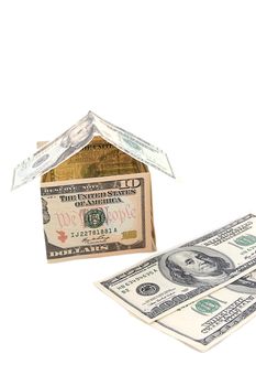 House made of money and dollars isolated on white