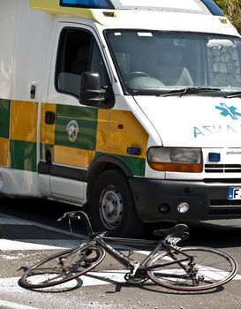 MOSTA, MALTA - APR16 - Bike belonging to injured cyclist lies in the street near ambulance on April 16, 2009