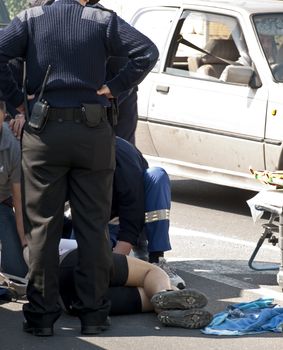 MOSTA, MALTA - APR16 - An injured cyclist receives first aid from ambulance crew and police on April 16, 2009