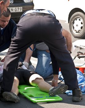 MOSTA, MALTA - APR16 - An injured cyclist being loaded into an ambulance on April 16, 2009