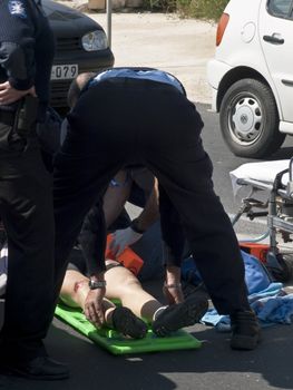 MOSTA, MALTA - APR16 - An injured cyclist being loaded into an ambulance on April 16, 2009