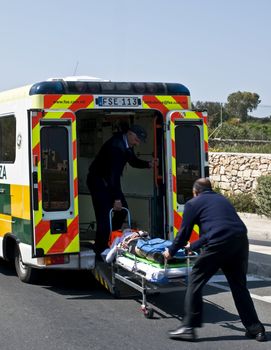 MOSTA, MALTA - APR16 - An injured cyclist being loaded into an ambulance on April 16, 2009