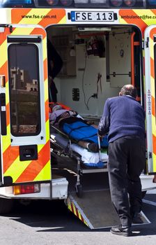MOSTA, MALTA - APR16 - An injured cyclist being loaded into an ambulance on April 16, 2009